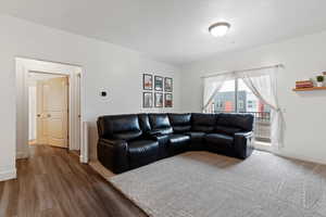 Living room featuring baseboards and wood finished floors