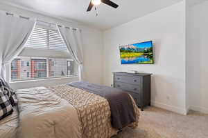 Bedroom featuring carpet floors and ceiling fan