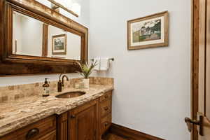 Bathroom featuring vanity and wood finished floors
