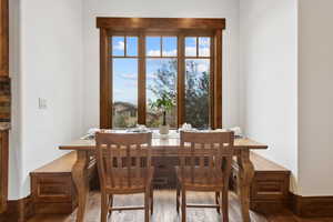 Dining room with healthy amount of natural light and wood finished floors
