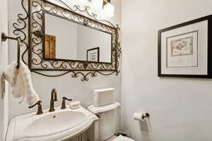 Bathroom featuring a sink and toilet