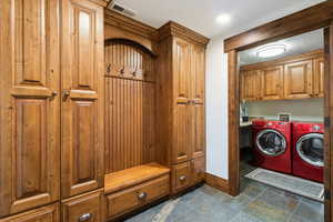 Laundry room with cabinet space and separate washer and dryer