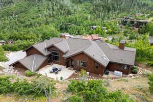 View from above of property with a heavily wooded area