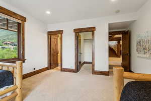 Bedroom featuring recessed lighting and a spacious closet