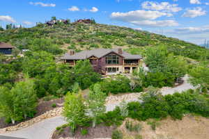 View from above of property with a heavily wooded area