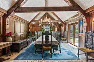 Dining space featuring a chandelier and stone tile floors