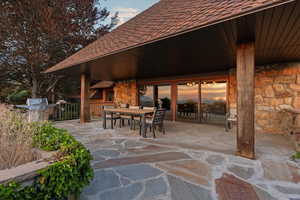 View of patio / terrace with a grill and outdoor dining area