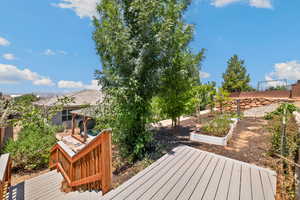 Wooden deck featuring a vegetable garden