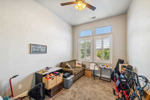 Playroom with carpet flooring and a ceiling fan