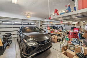 Garage featuring a garage door opener