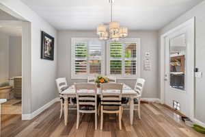 Dining room featuring a chandelier and light wood-style floors