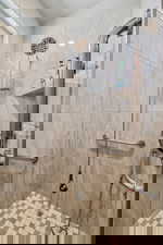 Bathroom featuring tiled shower