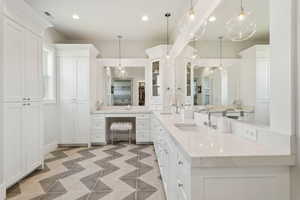 Bathroom featuring vanity and recessed lighting