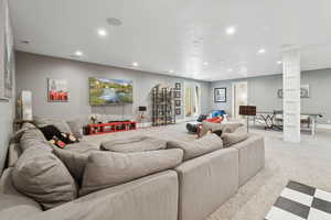 Living room with recessed lighting and carpet