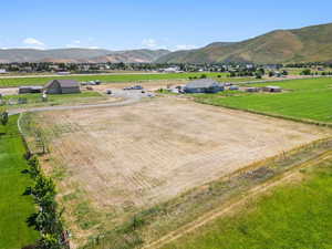 Aerial view of sparsely populated area with a mountain backdrop