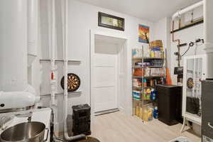 Washroom featuring wood finished floors