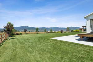 View of yard featuring a mountain view and a patio