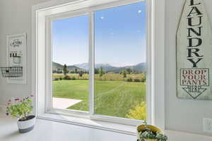 Doorway to outside featuring a mountain view and a rural view