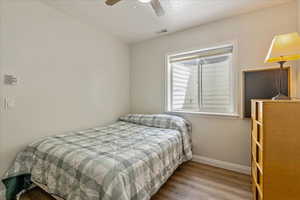 Bedroom 3 featuring wood finished floors and ceiling fan