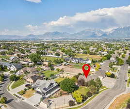 Aerial perspective of suburban area featuring a mountainous background