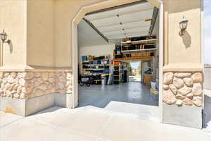 View of garage drive through RV entrance to back roll up door.