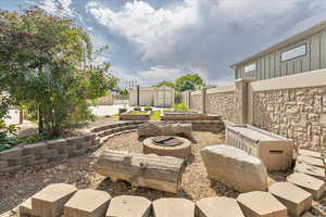 View of fire pit and seating area.