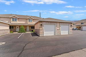 Townhome / multi-family property featuring stucco siding