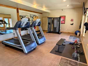 Workout room with baseboards and recessed lighting
