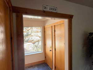 Exterior hallway with secure ski locker.