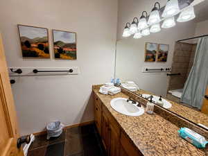 Master bathroom featuring granite vanity and radiant floor heating.