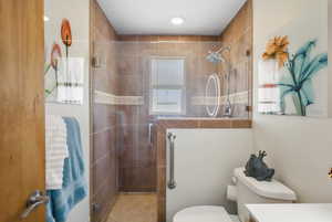 Full bathroom with a stall shower and vanity