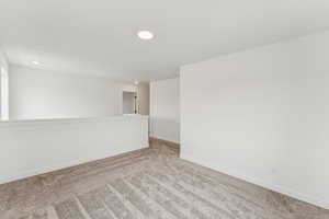Unfurnished room with carpet floors and baseboards