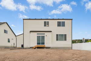 Rear view of house featuring entry steps
