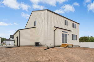 Rear view of house featuring entry steps