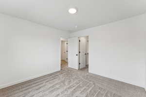 Spare room with carpet flooring and baseboards