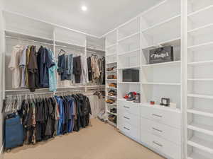 Spacious closet featuring carpet