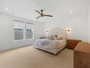 Bedroom featuring light colored carpet, recessed lighting, and a ceiling fan