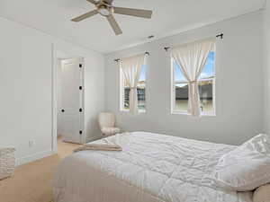 Bedroom with carpet flooring and a ceiling fan