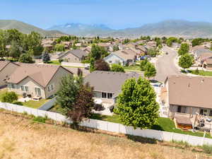 Aerial view of residential area featuring a mountain backdrop