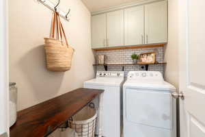 Laundry area with washer and dryer and cabinet space