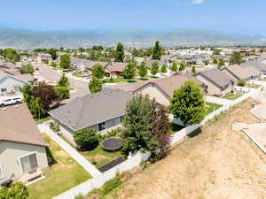 Aerial perspective of suburban area with a mountainous background