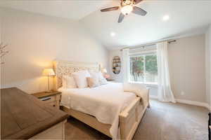 Carpeted bedroom with lofted ceiling, recessed lighting, and a ceiling fan