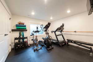 Exercise room featuring recessed lighting