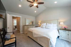 Bedroom with light carpet, lofted ceiling, recessed lighting, and a ceiling fan
