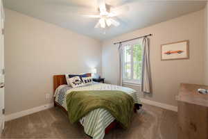 Bedroom with carpet floors and a ceiling fan