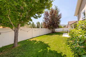 Fenced backyard featuring a patio