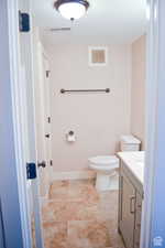 Bathroom with vanity and toilet