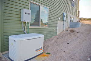 View of North side of home with generator.