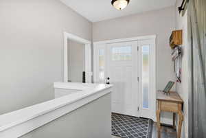 Entryway featuring dark wood finished floors