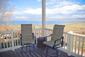 Wooden terrace with a water and mountain view